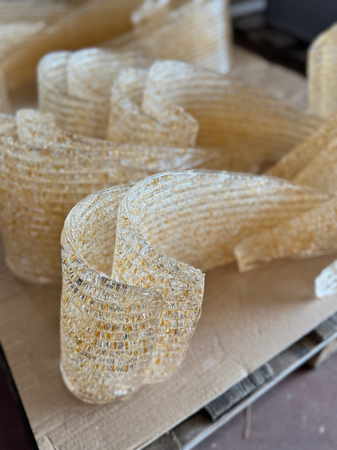 Handmade textured glass elements with warm golden detail